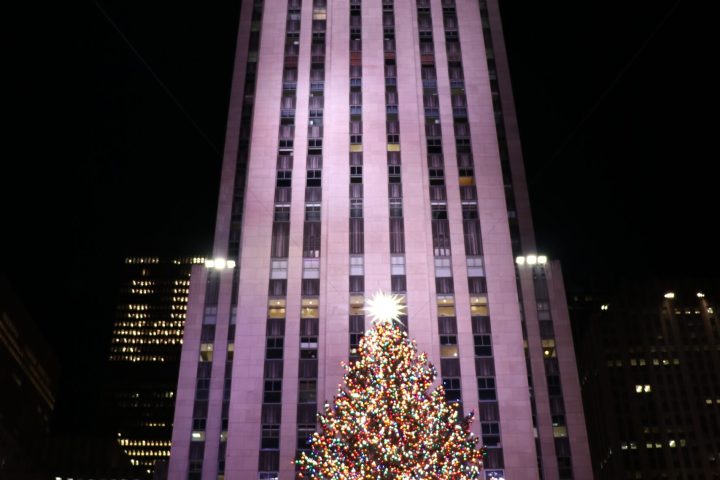 a tall building lit up at night
