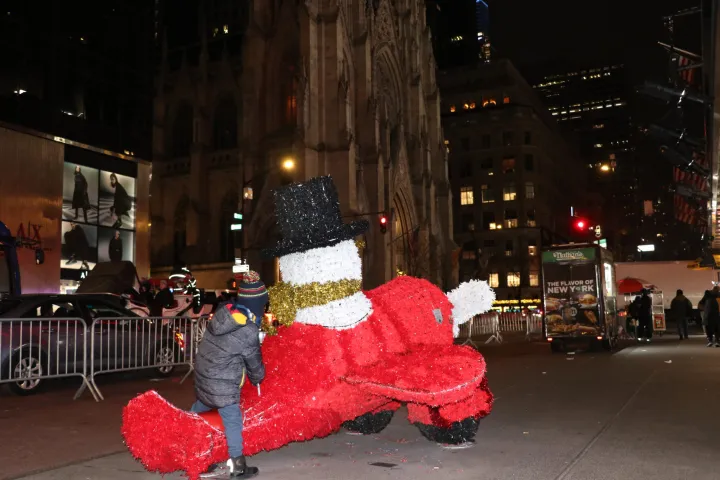 a person standing on a sidewalk
