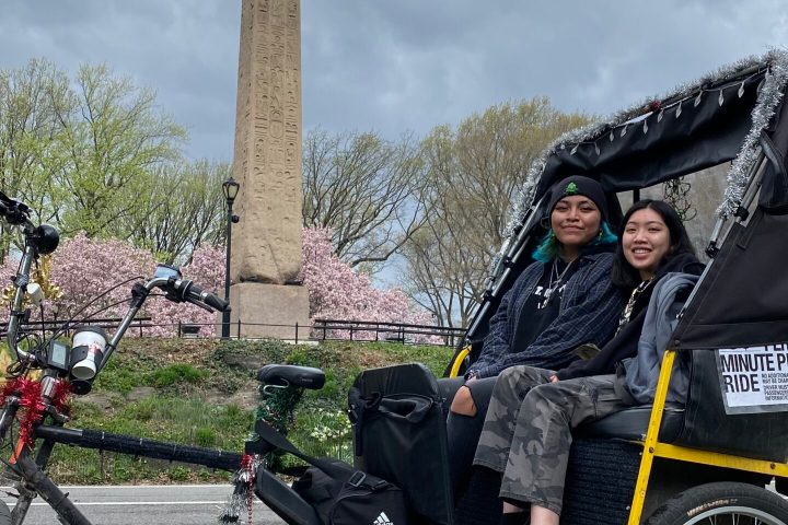 a person sitting on a bicycle