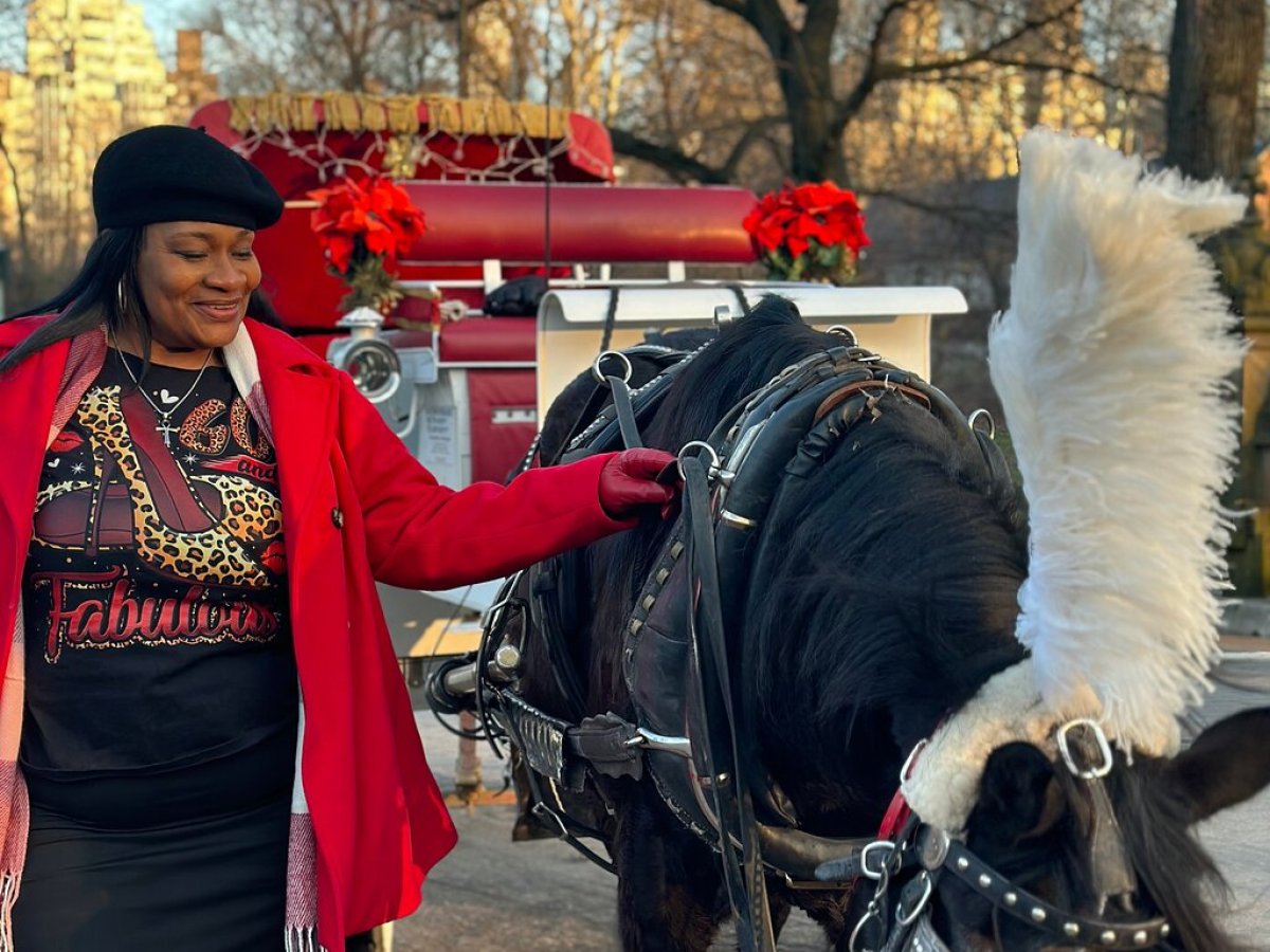 Jas Boothe et al. standing in front of a horse