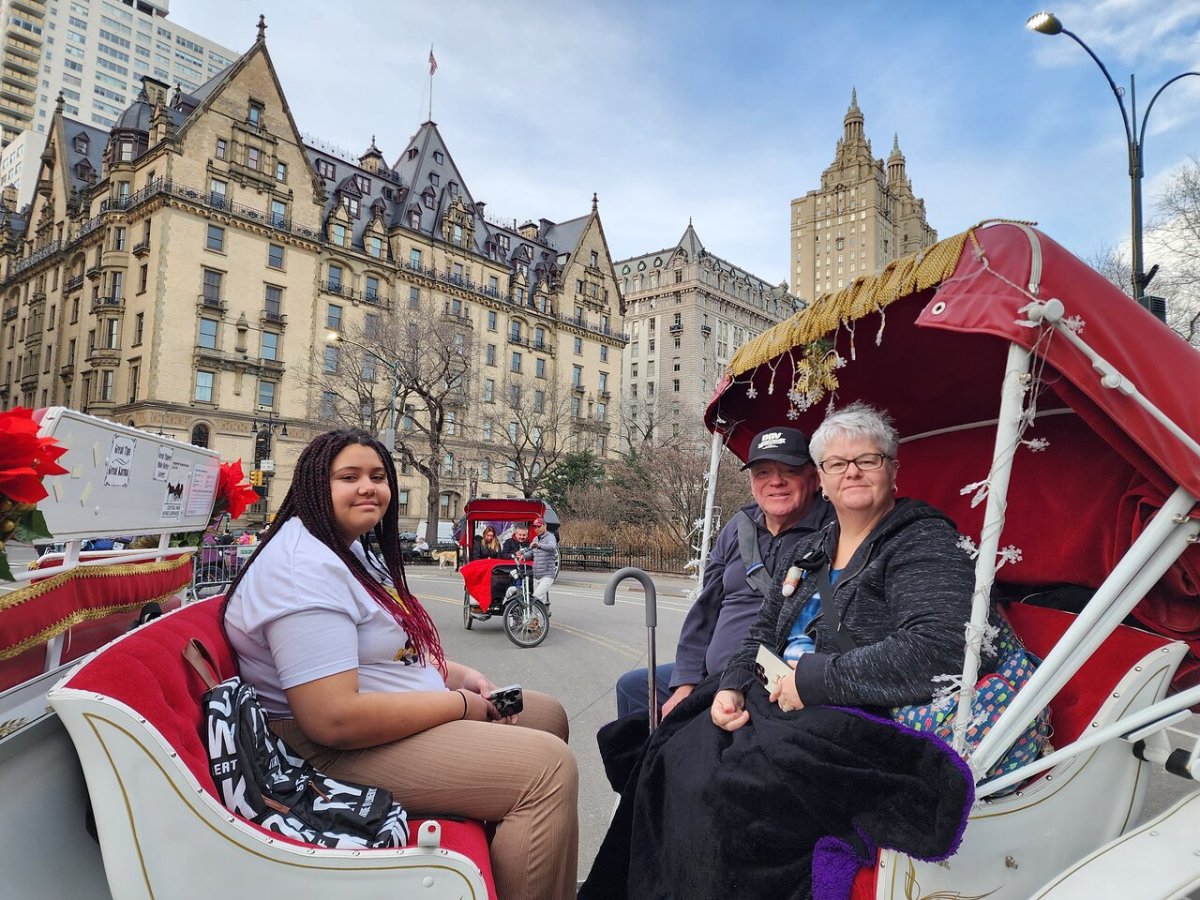 a group of people sitting in front of a building